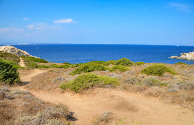 Scenic view of sea against blue sky