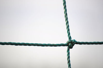 Close-up of tied rope against clear sky