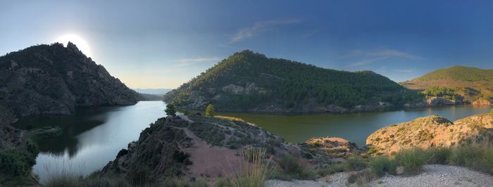 Panoramic view of lake and mountains against sky