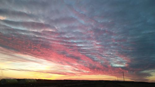 Scenic view of dramatic sky during sunset