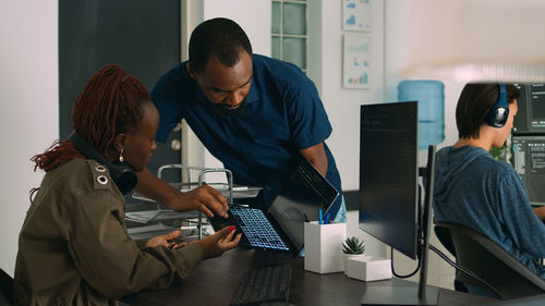 Side view of man working at office