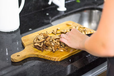 Close-up of woman preparing food