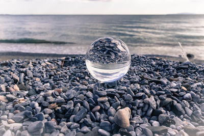 Close-up of stones on beach