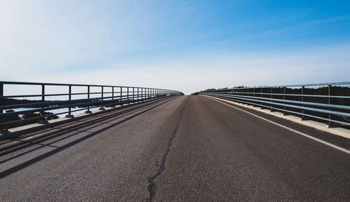 Bridge over sea against clear sky