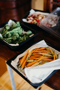 High angle view of vegetables in plates on table