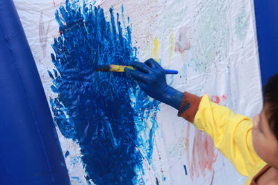 High angle view of boy painting