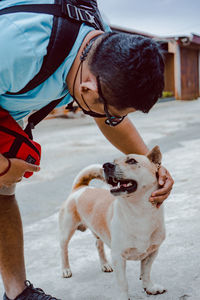 Full length of man with dog