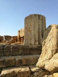 Low angle view of old ruins against clear sky