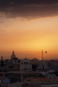 Buildings against sky during sunset