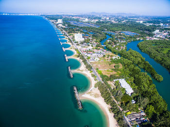 High angle view of sea and buildings in city