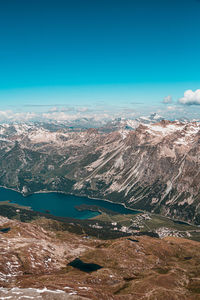 Aerial view of landscape against blue sky