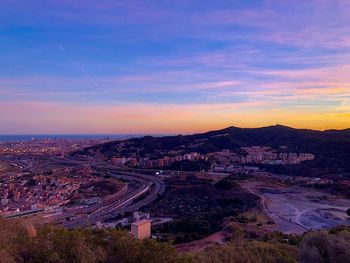 High angle view of cityscape against sky during sunset