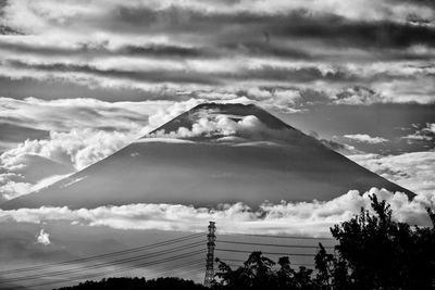 Low angle view of building and mountains against sky