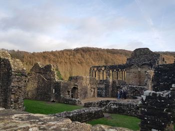 Old ruin building against cloudy sky