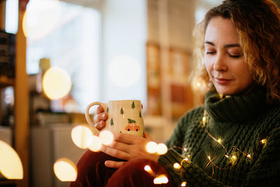 Portrait of girl playing with toy at home