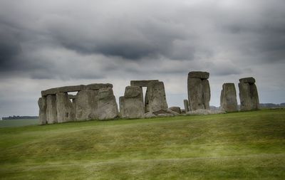 Built structure on landscape against sky