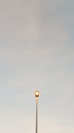 Low angle view of street light against sky