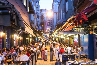 Group of people in restaurant at night