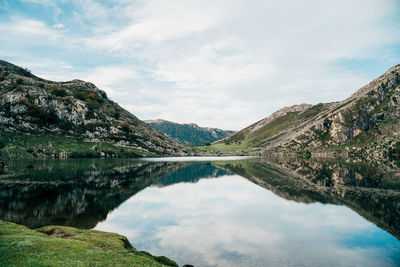 Scenic view of lake and mountains against sky