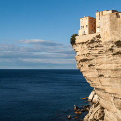 Scenic view of sea and rocks against sky