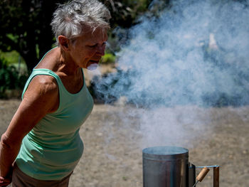 Close-up of woman standing on bench