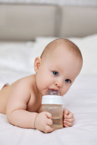 Portrait of cute girl drinking milk