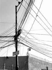 Low angle view of electricity pylon