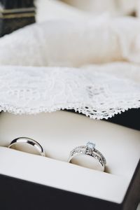 High angle close-up of wedding rings on table