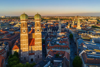 Wonderful sunset shining onto the frauenkirche towers in munich, germany