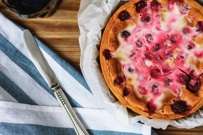 Directly above shot of tart and butter knife on table