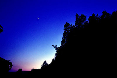 Low angle view of illuminated building against clear sky