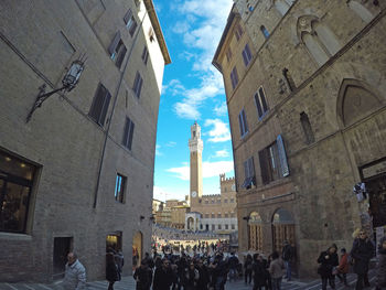 People in front of buildings