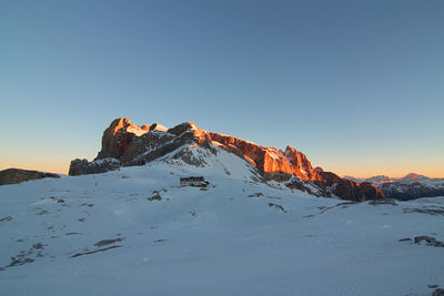 Pale di san martino. unesco italy. scenic view of snowcapped dolomites against sky during sunset.