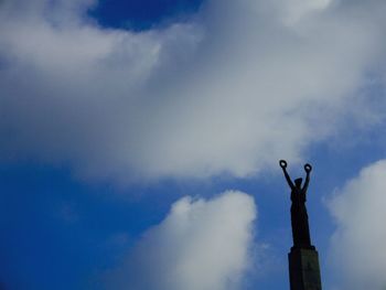 Low angle view of statue against sky