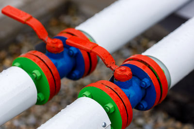 High angle view of multi colored rope tied to pipe