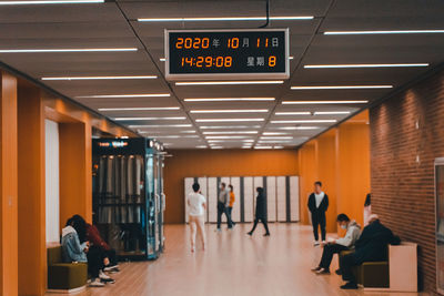 People standing in illuminated room