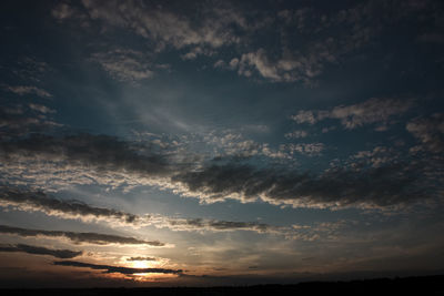 Scenic view of landscape against cloudy sky
