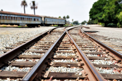 Surface level of railroad tracks against sky