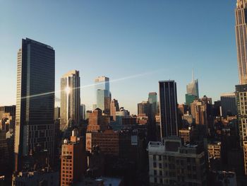 Urban skyline against clear sky