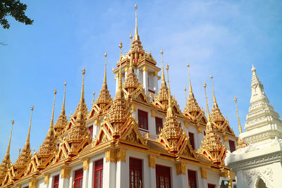 Golden spires of the historic loha prasat inside wat ratchanatdaram temple, bangkok city, thailand