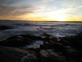 Scenic view of sea against sky during sunset