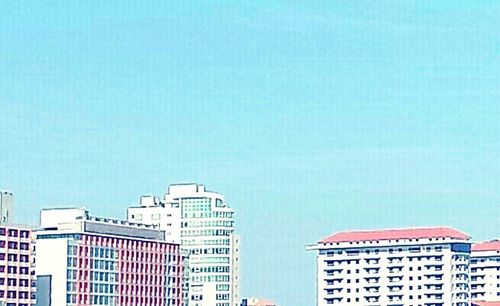 Low angle view of buildings against clear sky