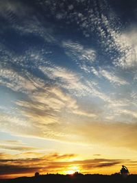 Low angle view of dramatic sky during sunset