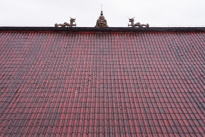 Red roof against sky