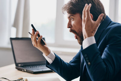 Businesswoman using mobile phone