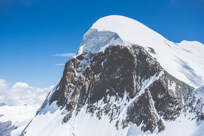 Low angle view of snow against clear sky