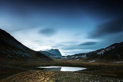 Scenic view of mountains against sky during winter