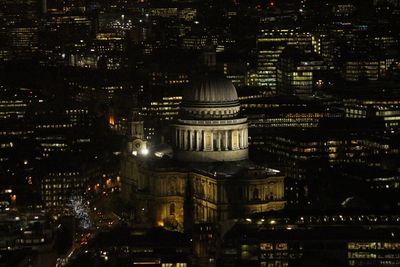 Illuminated buildings in city at night