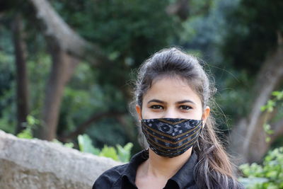 Portrait of a beautiful young woman outdoors