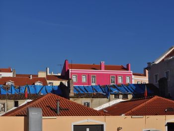 Low angle view of house against blue sky